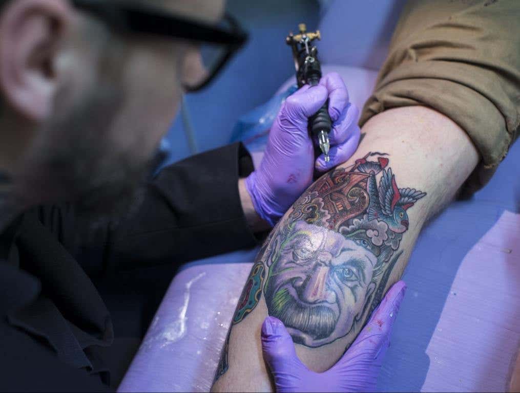 Artist and tattooist Dan Gold creates a tattoo