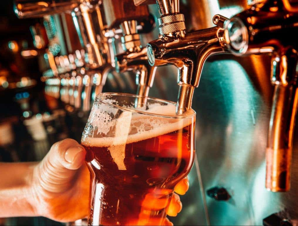 beer being poured from tap