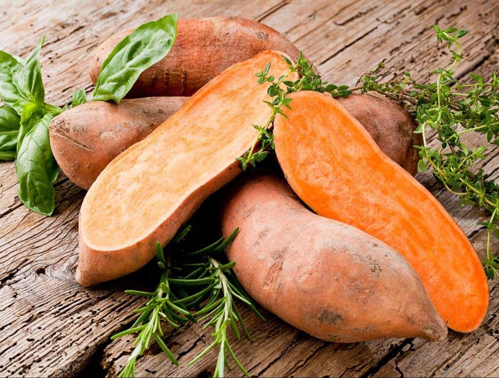 Sweet potato on Wooden background