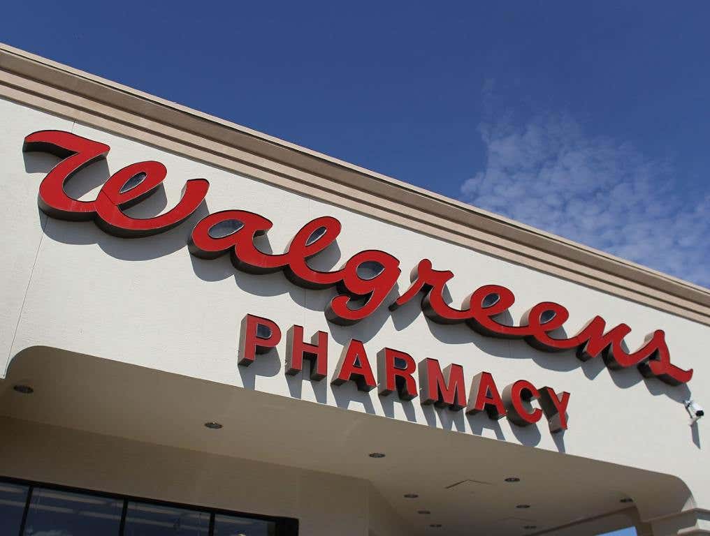 A sign is seen at a Walgreens store.