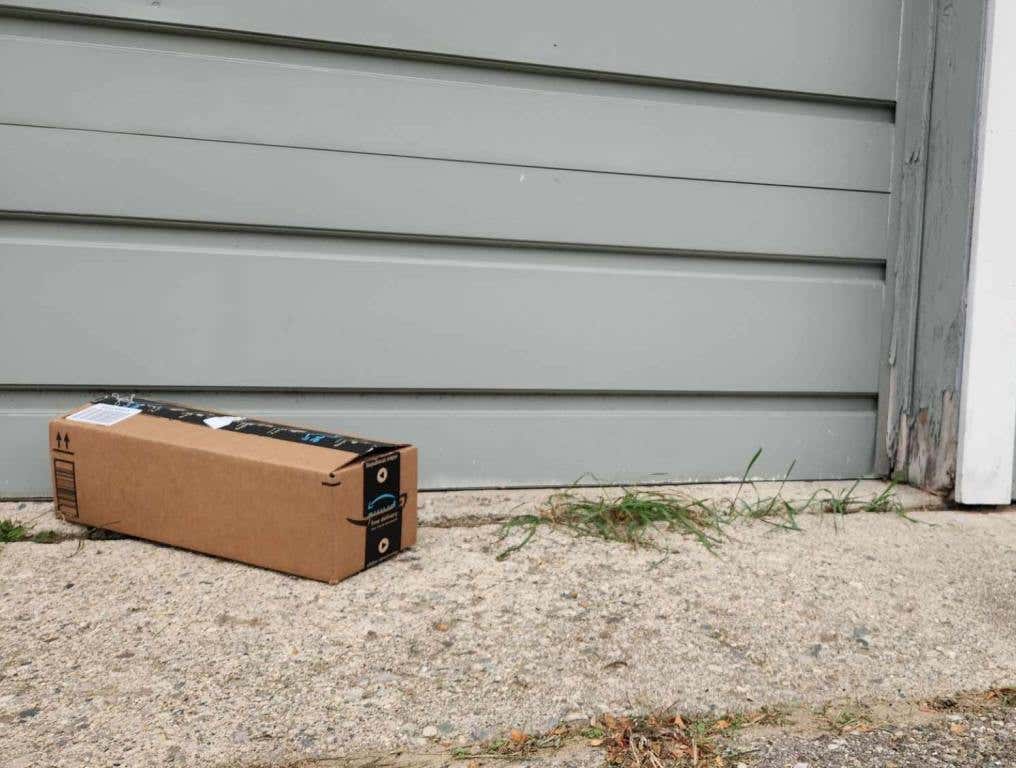 An image of an Amazon delivery infront of garage door as photographed, amazon key in garage concept