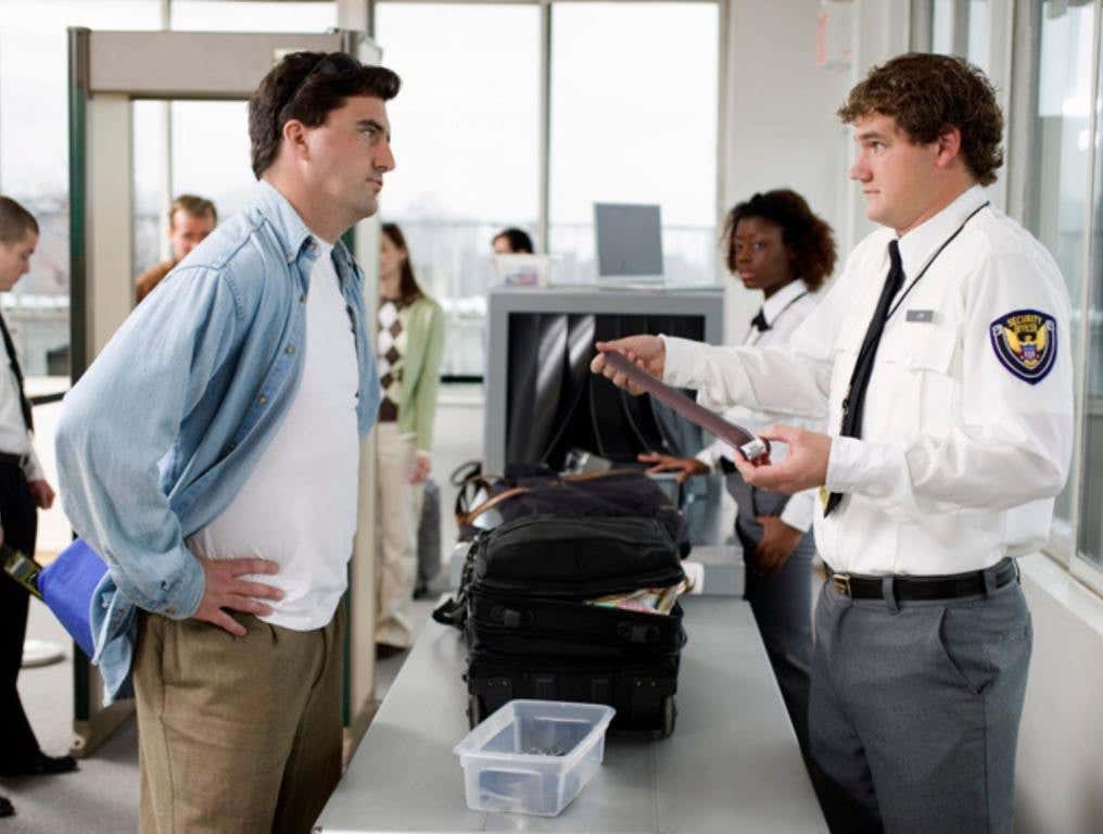 Security guard and man at airport , tsa confiscations concept.