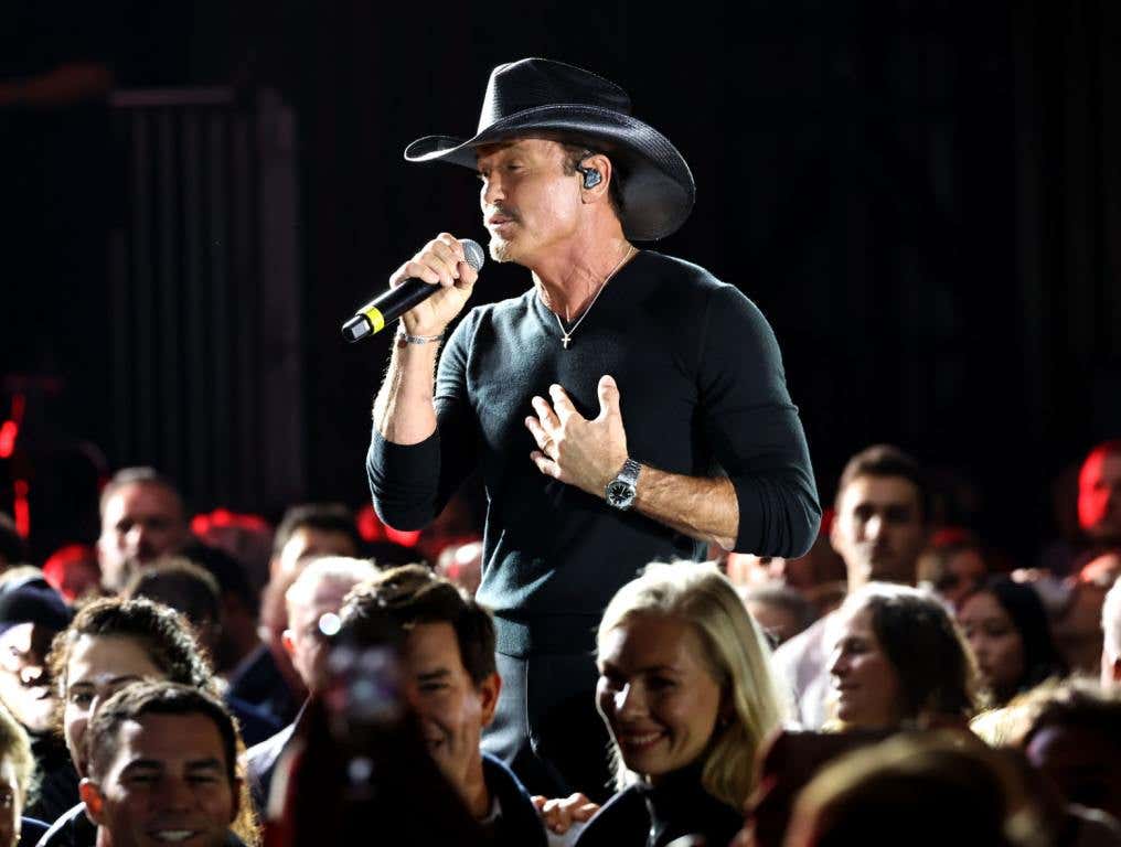 Tim McGraw Knows What Song He Can't Skip - Tim on stage in black.