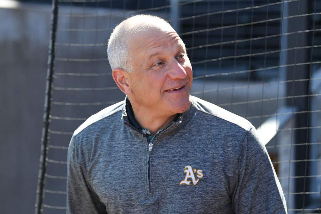 LAS VEGAS, NEVADA - MARCH 08: President Marc Badain of the Athletics watches battling practice before a spring training game between the Athletics and the Arizona Diamondbacks at Las Vegas Ballpark on March 08, 2025 in Las Vegas, Nevada. The Athletics defeated the Diamondbacks 4-2. (Photo by Candice Ward/Getty Images)