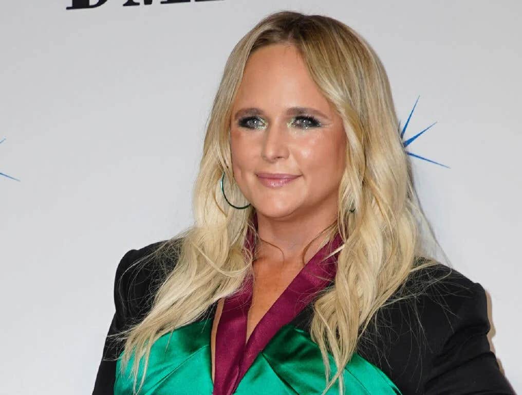 Miranda Lambert poses in a black cowboy poutfit.