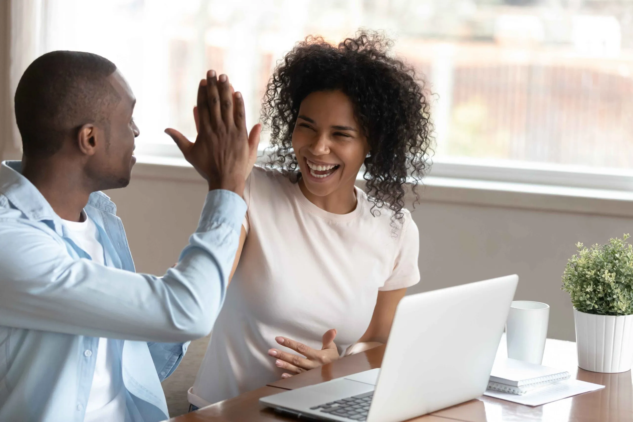 Couple high-fiving each other 