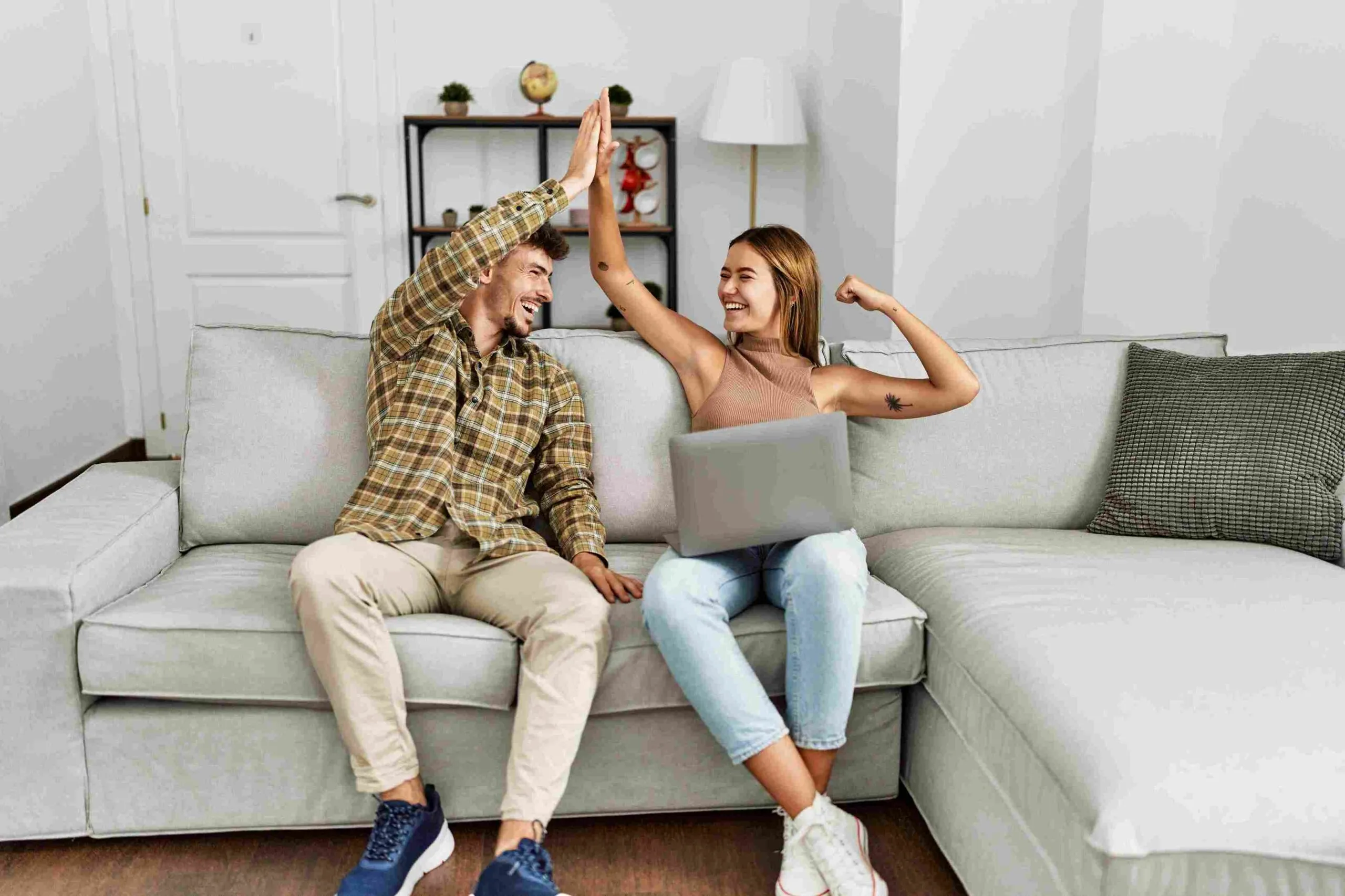 Couple giving each other support while they're sitting on the couch